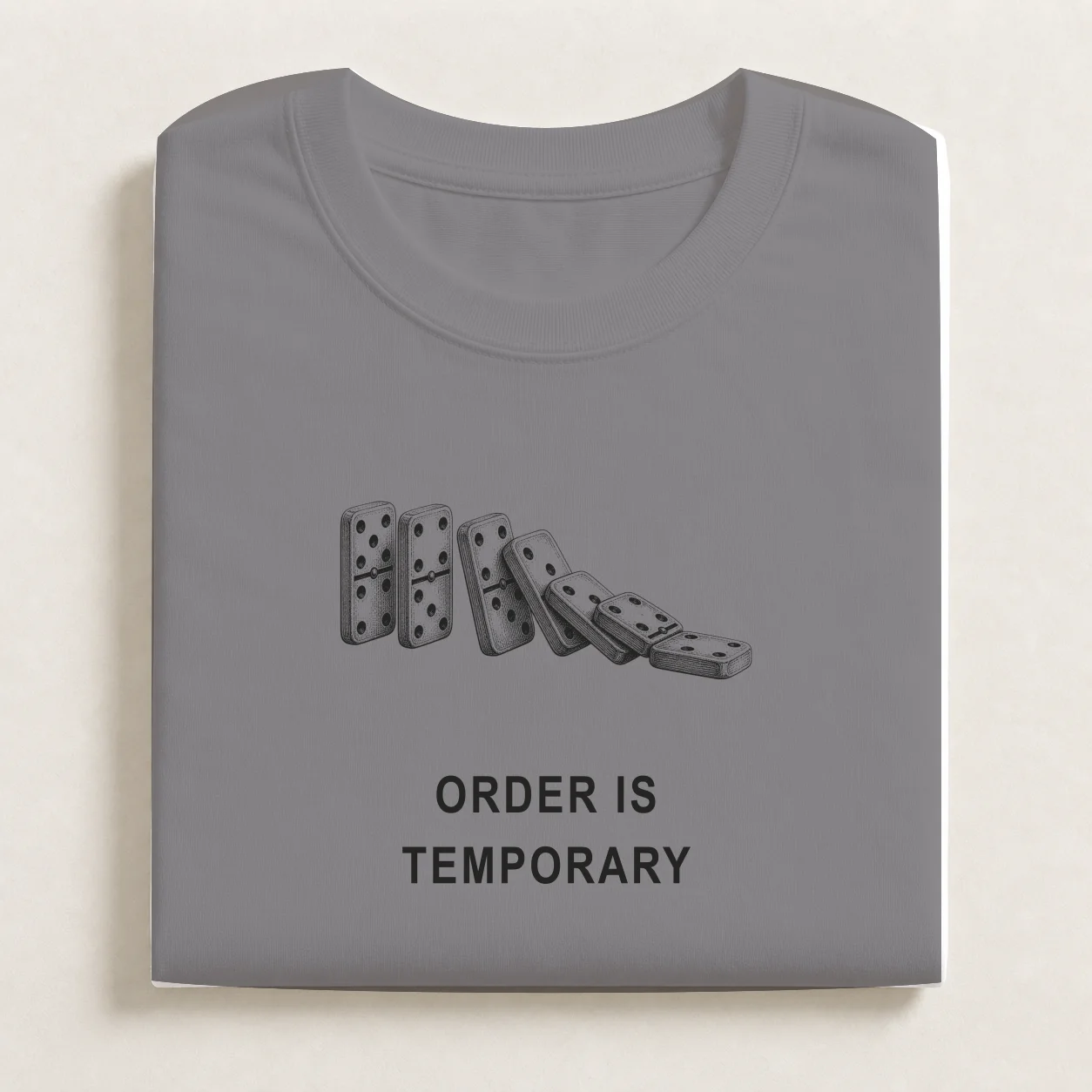 Order Is Temporary printed on a folded Carbon Grey T-shirt.