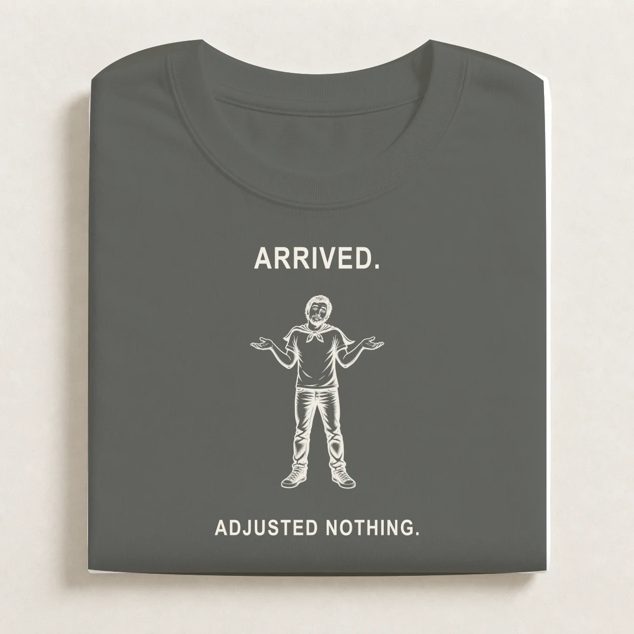Mild Inconvenience printed on a folded Charcoal T-shirt.